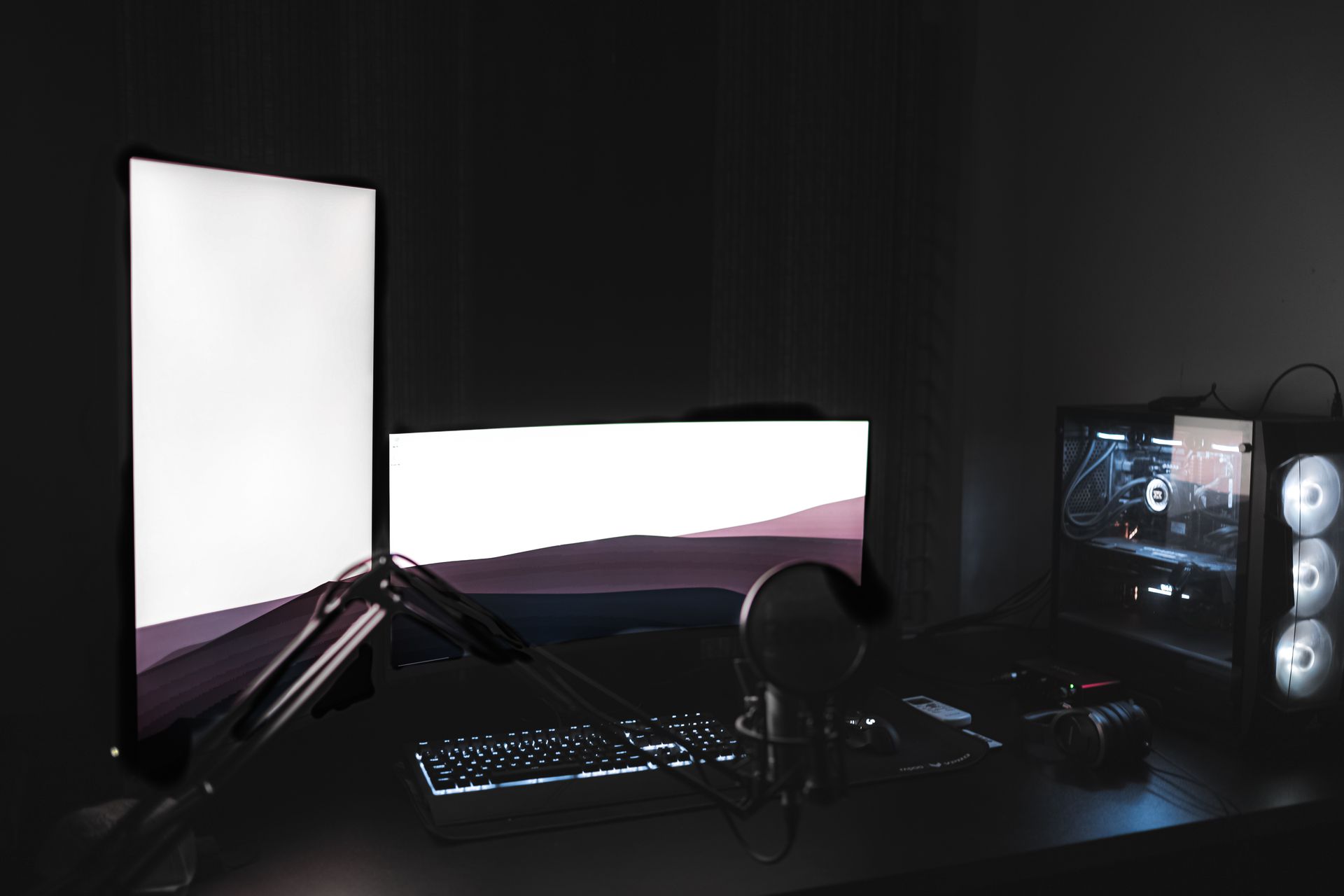 Gaming PC setup with cyan lights